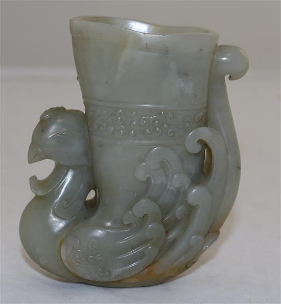 A Chinese archaistic pale celadon jade phoenix rhyton, height 10.2cm